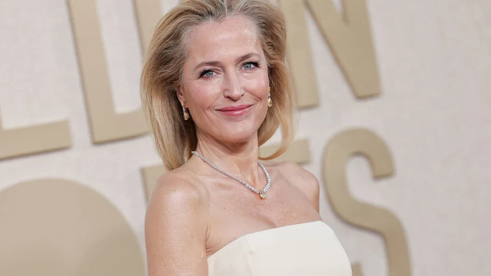 Gillian Anderson Dazzles Paris in Stunning White Gown Ahead of Fashion Week