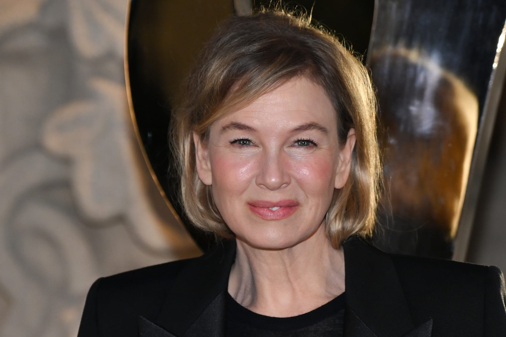 Renée Zellweger’s Viral Sheer Saint Laurent Look Stuns Paris Fashion Elite
