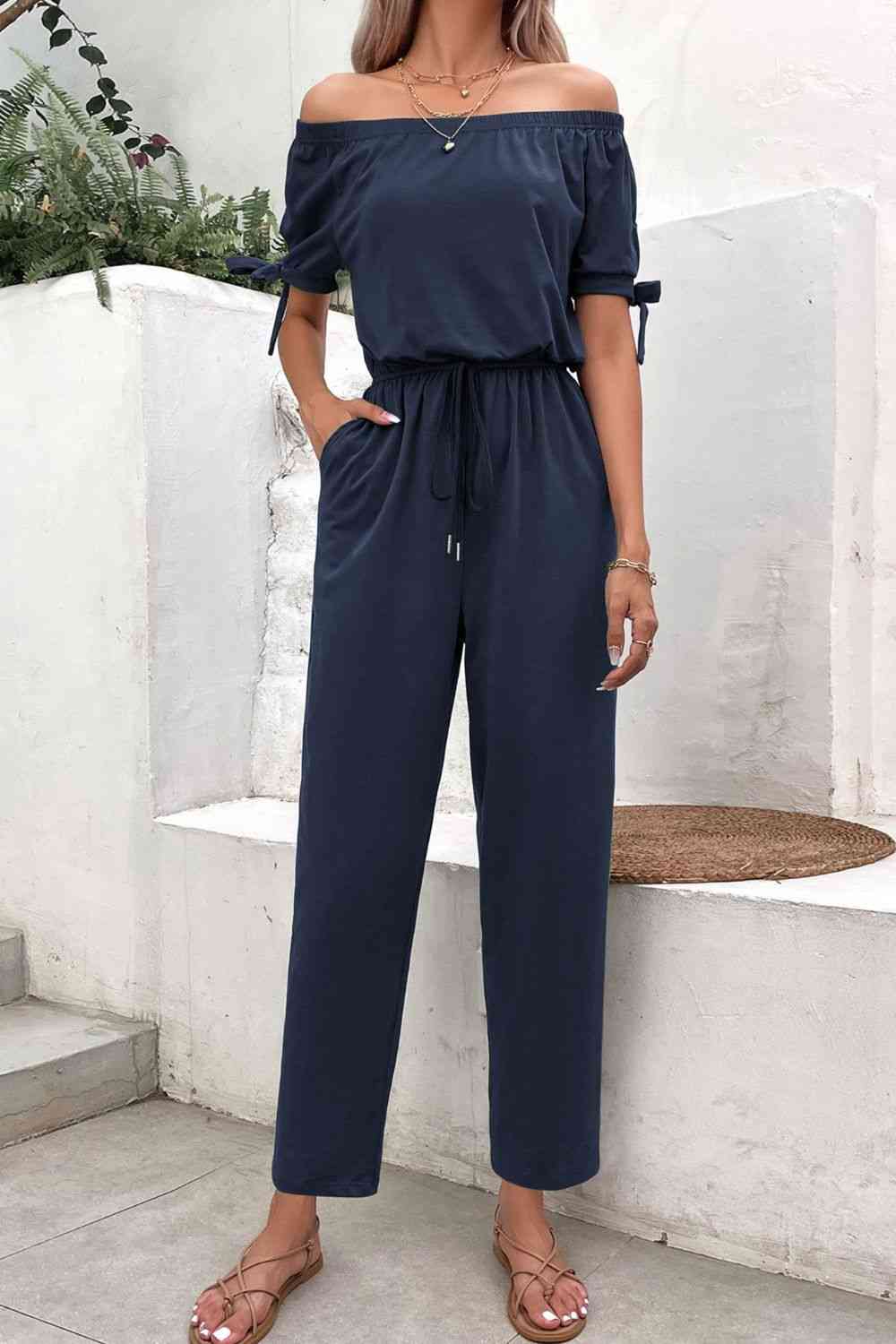 Buy Off-Shoulder Tie Cuff Jumpsuit with Pockets by Hundredth