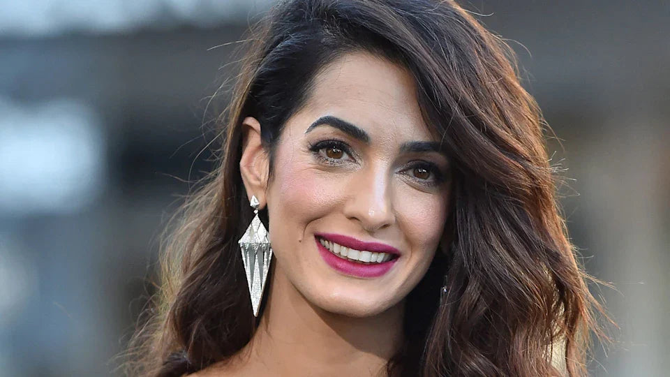 Amal Clooney’s Plunge-Neck Mini Dress Defines Modern Party Girl Glamour