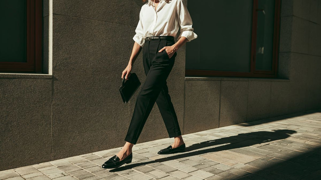 A slim cropped cigarette trouser ending at the ankle paired with a low flat shoe, illustrating the proportion of the ankle-length cut