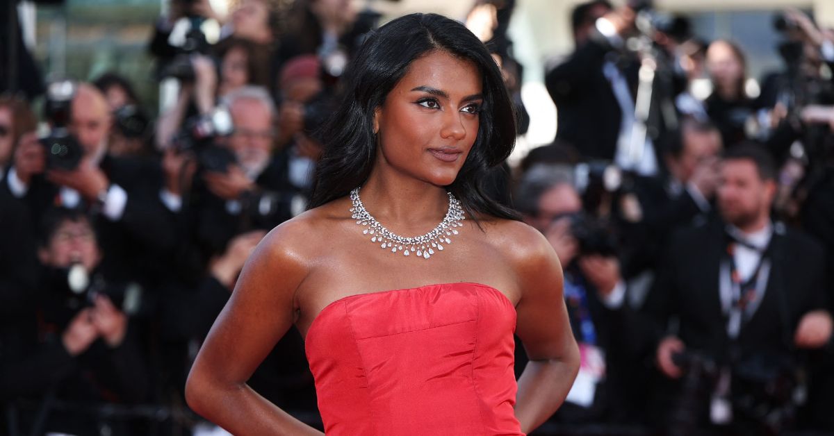 Simone Ashley arrived at Cannes yesterday in a twenty-one-year-old Alexander McQueen gown.