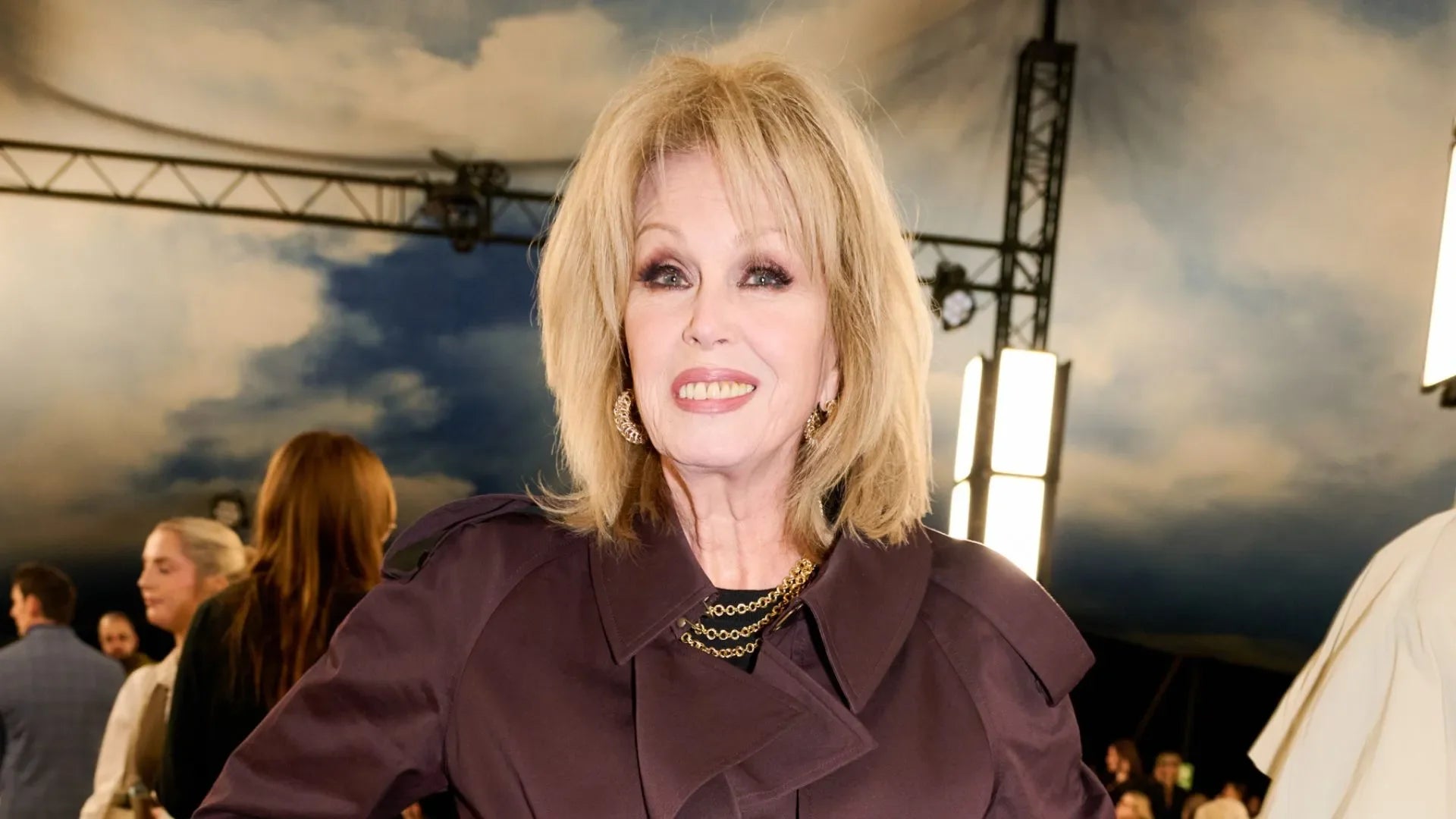 Joanna Lumley’s Wine Red Trench at Burberry Sets Autumn’s Bold Palette