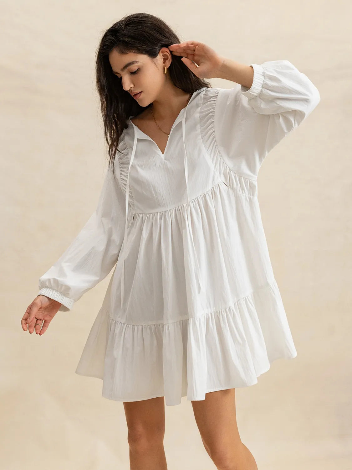 Buy Tiered Tie Neck Long Sleeve Mini Dress by Faz