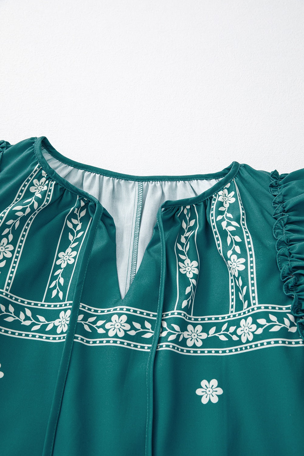 Buy Floral Ruffle Puff Sleeve Tie Neck Mini Dress by Faz