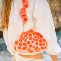 The Arnoldi Peachpuff Clutch Bag in Orange & Peach