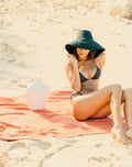 The Riri Jute Handwoven Straw Hat in Black