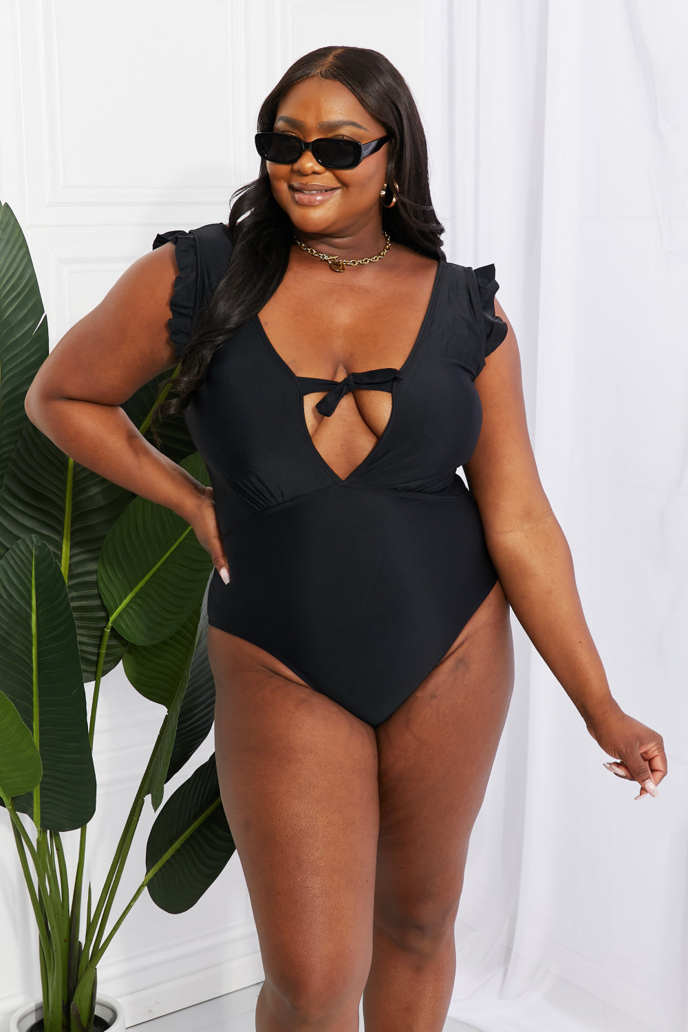 Buy Seashell Ruffle Sleeve One-Piece in Black by Marina West Swim