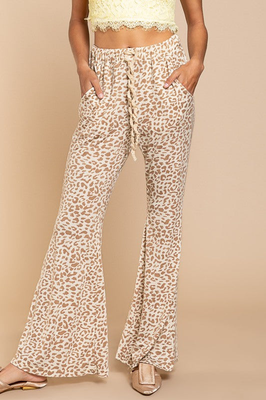 Buy POL Ivory Taupe Animal Print Flare Leg Pants by Sensual Fashion Boutique by Sensual Fashion Boutique