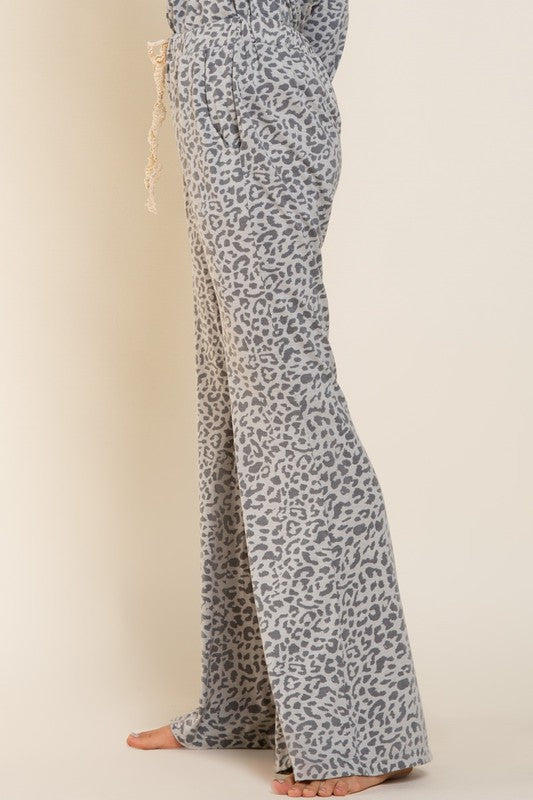 Buy POL Gray Mix Animal Print Flare Leg Pants by Sensual Fashion Boutique by Sensual Fashion Boutique