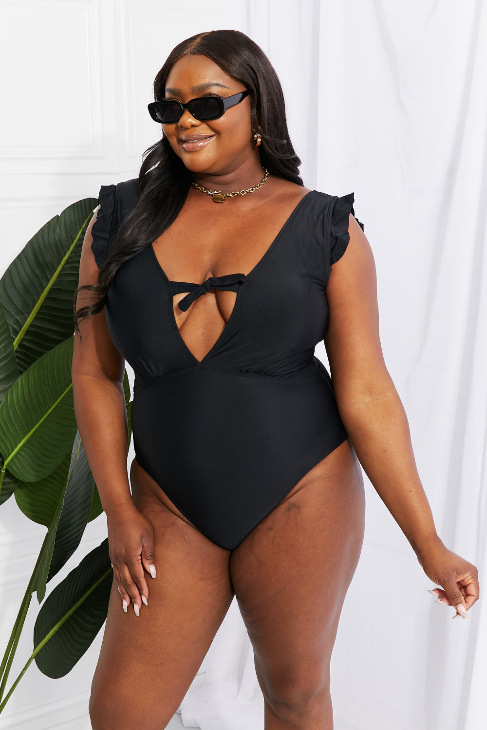 Buy Seashell Ruffle Sleeve One-Piece in Black by Marina West Swim