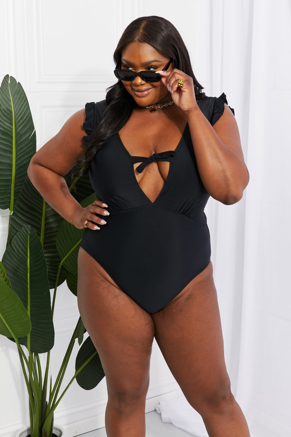 Buy Seashell Ruffle Sleeve One-Piece in Black by Marina West Swim